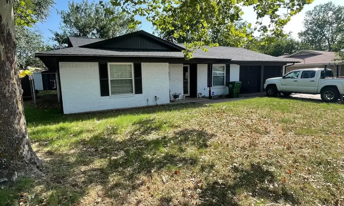 Professional roofing crew working on a residential roof in Imperial Beach